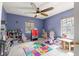 bedroom featuring tile flooring, ceiling fan, and playful decor, perfect for a space at 3621 Sw 52Nd Ter, Ocala, FL 34474