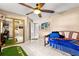 Cozy bedroom with tile flooring, ceiling fan, and a large closet, perfect for relaxation and storage at 3621 Sw 52Nd Ter, Ocala, FL 34474