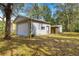 Detached one car garage surrounded by trees and foliage at 3621 Sw 52Nd Ter, Ocala, FL 34474