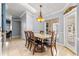 Elegant dining room featuring a decorative light fixture and a view to the outside at 3621 Sw 52Nd Ter, Ocala, FL 34474