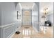 Inviting foyer with arched doorway, decorative tile inlay, and elegant chandelier at 3621 Sw 52Nd Ter, Ocala, FL 34474
