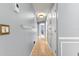Long hallway with tile flooring, neutral walls, and decorative shelving at 3621 Sw 52Nd Ter, Ocala, FL 34474