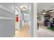 Inviting hallway with neutral colors, tile floors, and seamless flow to other living spaces at 3621 Sw 52Nd Ter, Ocala, FL 34474
