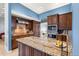 Kitchen island with granite countertops and stainless appliances, creating a functional and stylish space at 3621 Sw 52Nd Ter, Ocala, FL 34474