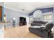 Spacious living room with a vaulted ceiling, large windows, and a cozy seating area at 3621 Sw 52Nd Ter, Ocala, FL 34474