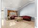 Spacious living room with large window, tiled floor and decorative trim at 3621 Sw 52Nd Ter, Ocala, FL 34474