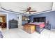 Main bedroom featuring a dark wood bed, tile floors and a chest at 3621 Sw 52Nd Ter, Ocala, FL 34474