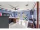 Main bedroom with tile floors, large windows, and blue walls at 3621 Sw 52Nd Ter, Ocala, FL 34474