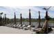 Resort-style lounge chairs overlooking a lake within a modern community at 4236 Sw 53Rd Lane Rd, Ocala, FL 34474