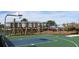 Community basketball court and playground surrounded by lush landscaping and multi-story apartment buildings at 4250 Sw 53Rd Lane Rd, Ocala, FL 34474