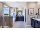 Bright bathroom featuring a glass-enclosed shower, soaking tub, double vanity with granite countertops, and modern fixtures at 4250 Sw 53Rd Lane Rd, Ocala, FL 34474