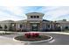 Attractive community clubhouse with stone accents, landscaping, and a circular driveway at 4250 Sw 53Rd Lane Rd, Ocala, FL 34474