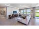 Cozy living room with modern decor, designer accents, and large windows overlooking the water, creating a serene atmosphere at 4250 Sw 53Rd Lane Rd, Ocala, FL 34474