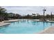 Large, well-maintained community swimming pool with plenty of lounge seating and cabanas for shade at 4250 Sw 53Rd Lane Rd, Ocala, FL 34474