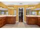 Spacious bathroom featuring double vanities, mirrors, and a doorway view into the main bedroom at 4320 Sw 112Th St, Ocala, FL 34476