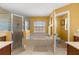 Bright bathroom featuring a soaking tub, separate shower, and a window with natural light at 4320 Sw 112Th St, Ocala, FL 34476