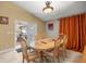 Cozy dining room area with natural light and a view of the porch area at 4320 Sw 112Th St, Ocala, FL 34476
