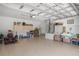 Spacious three car garage with ample storage, lots of light, and a tile floor at 4320 Sw 112Th St, Ocala, FL 34476