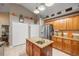 Open kitchen features stainless steel appliances and granite countertops on the island and surrounding area at 4320 Sw 112Th St, Ocala, FL 34476