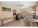 Outdoor kitchen area with a ceiling fan, grill, sink, and table at 4320 Sw 112Th St, Ocala, FL 34476