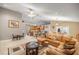 Comfortable open-concept living room featuring natural light and access to dining and kitchen areas at 4320 Sw 112Th St, Ocala, FL 34476
