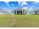 View of the well-manicured backyard, offering ample space for recreation and outdoor living at 4384 Pezzullo Cir, The Villages, FL 32163