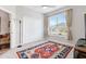 Bright bedroom with a spacious closet, ceiling fan, and an ornate area rug at 4384 Pezzullo Cir, The Villages, FL 32163