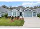 Charming single-story home with well-manicured lawn, mature landscaping, and a welcoming entrance at 4384 Pezzullo Cir, The Villages, FL 32163