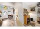 Hallway and entry way of a decorated home with neutral walls and wood-look floors at 4384 Pezzullo Cir, The Villages, FL 32163