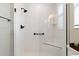 Bright shower features white subway tile, matte black hardware, frameless glass, and a shower seat at 4384 Pezzullo Cir, The Villages, FL 32163