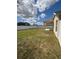 Large backyard with white fence and covered porch at 4954 Sw 40Th Pl, Ocala, FL 34474