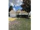 Charming single-story home with a well-manicured lawn and attached two-car garage at 4954 Sw 40Th Pl, Ocala, FL 34474