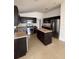 Modern kitchen with stainless steel appliances and an island at 4954 Sw 40Th Pl, Ocala, FL 34474