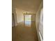 Bright living room featuring a sliding door and ceiling fan at 4954 Sw 40Th Pl, Ocala, FL 34474