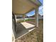 Covered patio overlooking a large backyard with a white fence at 4954 Sw 40Th Pl, Ocala, FL 34474
