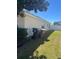 Side yard with trash cans and partially fenced at 4954 Sw 40Th Pl, Ocala, FL 34474