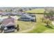 Spacious backyard featuring a well-maintained lawn, screened patio and beautiful green views at 5111 Nw 35Th Pl, Ocala, FL 34482