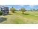 Relaxing backyard with a screened-in lanai overlooking the lush green golf course at 5111 Nw 35Th Pl, Ocala, FL 34482