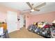 Bright bedroom with a whimsical decor, ceiling fan, and a cozy bed at 5111 Nw 35Th Pl, Ocala, FL 34482