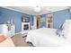 Comfortable bedroom with fireplace, bright blue walls and white accents, offering a relaxing atmosphere at 5111 Nw 35Th Pl, Ocala, FL 34482