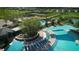 Aerial view showcasing a community pool with seating, amenities and landscaping at 5111 Nw 35Th Pl, Ocala, FL 34482