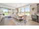 Bright dining area featuring a wood table, elegant chairs, and a seamless transition to the outdoor living space at 5111 Nw 35Th Pl, Ocala, FL 34482