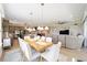 Open-concept dining area and living room combination with a view of the kitchen at 5111 Nw 35Th Pl, Ocala, FL 34482