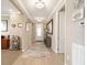 Foyer with a decorative rug, tile flooring, and a view into the open floor plan at 5111 Nw 35Th Pl, Ocala, FL 34482
