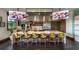 Modern kitchen featuring an island with seating, stainless steel appliances, and stylish decor at 5111 Nw 35Th Pl, Ocala, FL 34482