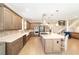 Modern kitchen featuring custom cabinets, stainless steel appliances, a spacious island, and an open-concept design at 5111 Nw 35Th Pl, Ocala, FL 34482