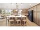 Modern kitchen with an expansive island, pendant lighting, and stainless steel appliances at 5111 Nw 35Th Pl, Ocala, FL 34482