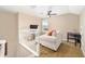 Cozy living room with neutral tones, comfortable seating, and a ceiling fan at 5111 Nw 35Th Pl, Ocala, FL 34482