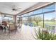 Screened patio with ample seating and golf course views at 5111 Nw 35Th Pl, Ocala, FL 34482