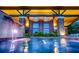 Beautiful pool area featuring a waterfall and elegant building design at 5111 Nw 35Th Pl, Ocala, FL 34482